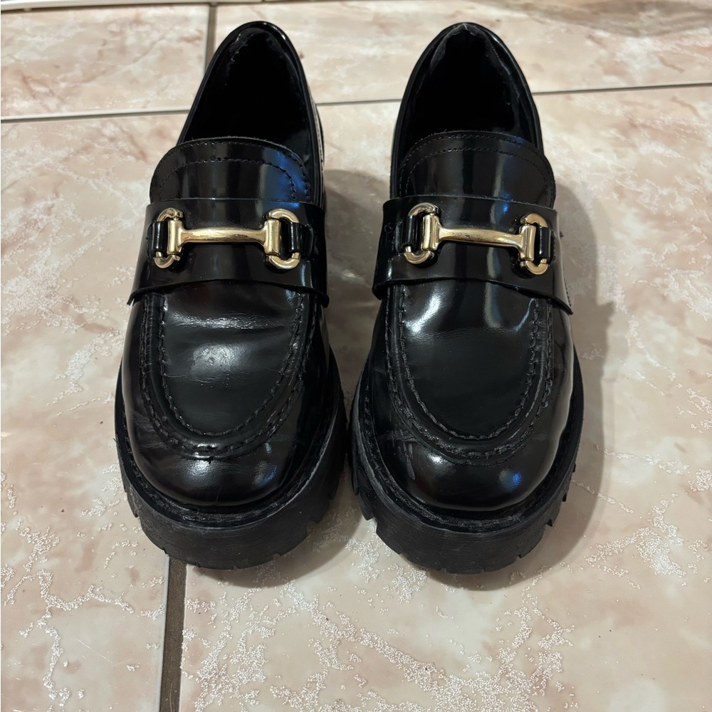 Black Steve Madden Loafers with Gold Buckle